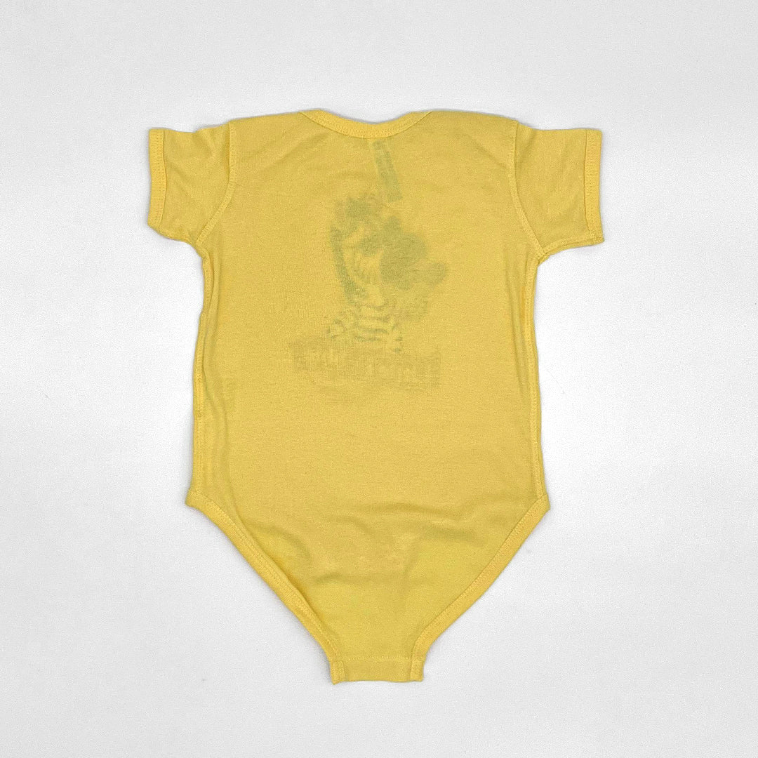 Back view of the plain yellow Little Debbie onesie featuring Zain the Zebra, with no designs or images.