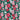 Close-up of Little Debbie Hawaiian Dog shirt showcasing the green Little Debbie Hawaiian pattern, highlighted by red and white designs of Little Debbie Christmas Tree Cakes, Little Debbie Red Ribbon Logos, and an aloha leaf and flower motif.