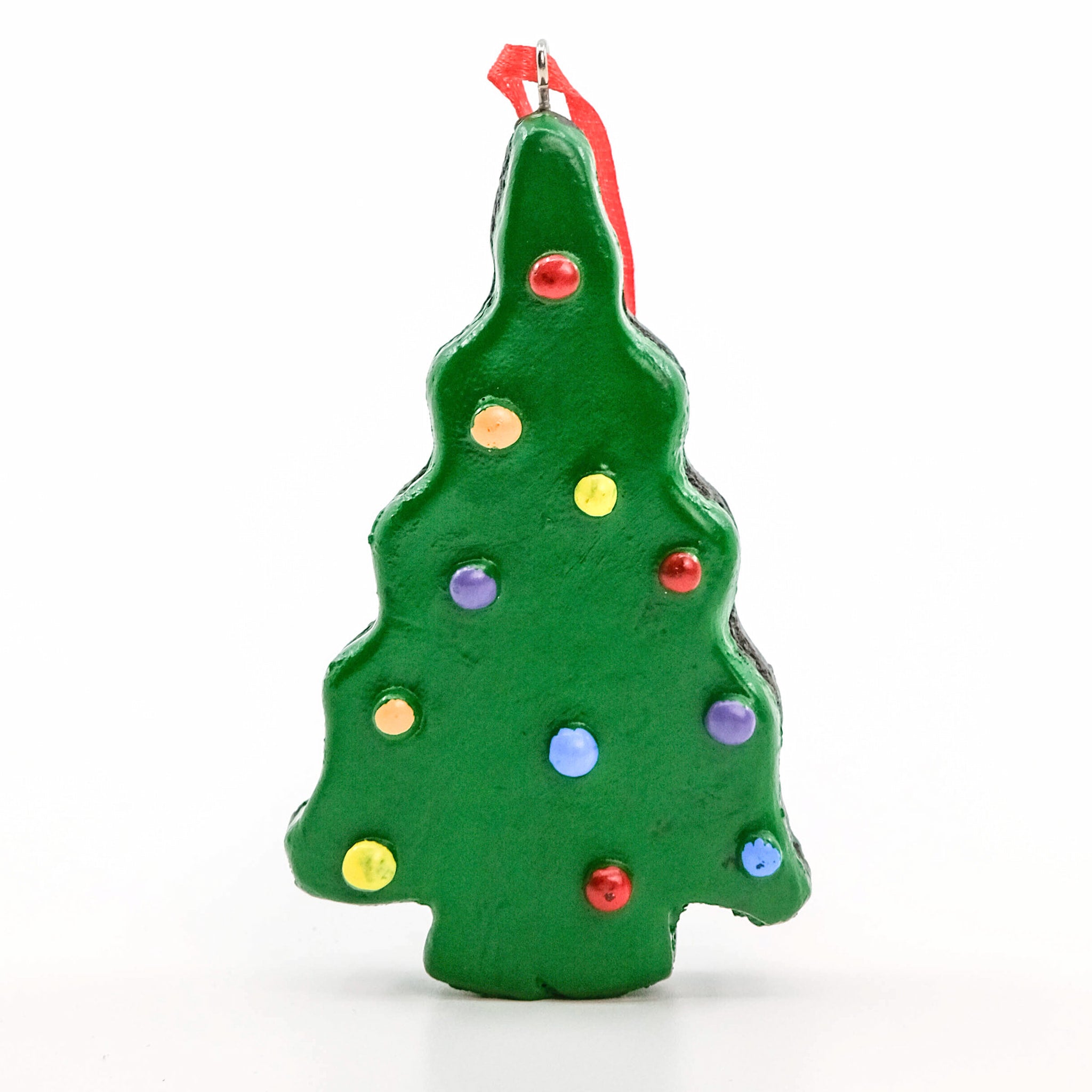 A Little Debbie® Christmas Tree Brownie® Ornament shaped like a green frosted Christmas tree brownie with colorful candy decorations and a red ribbon for hanging, displayed against a white background.
