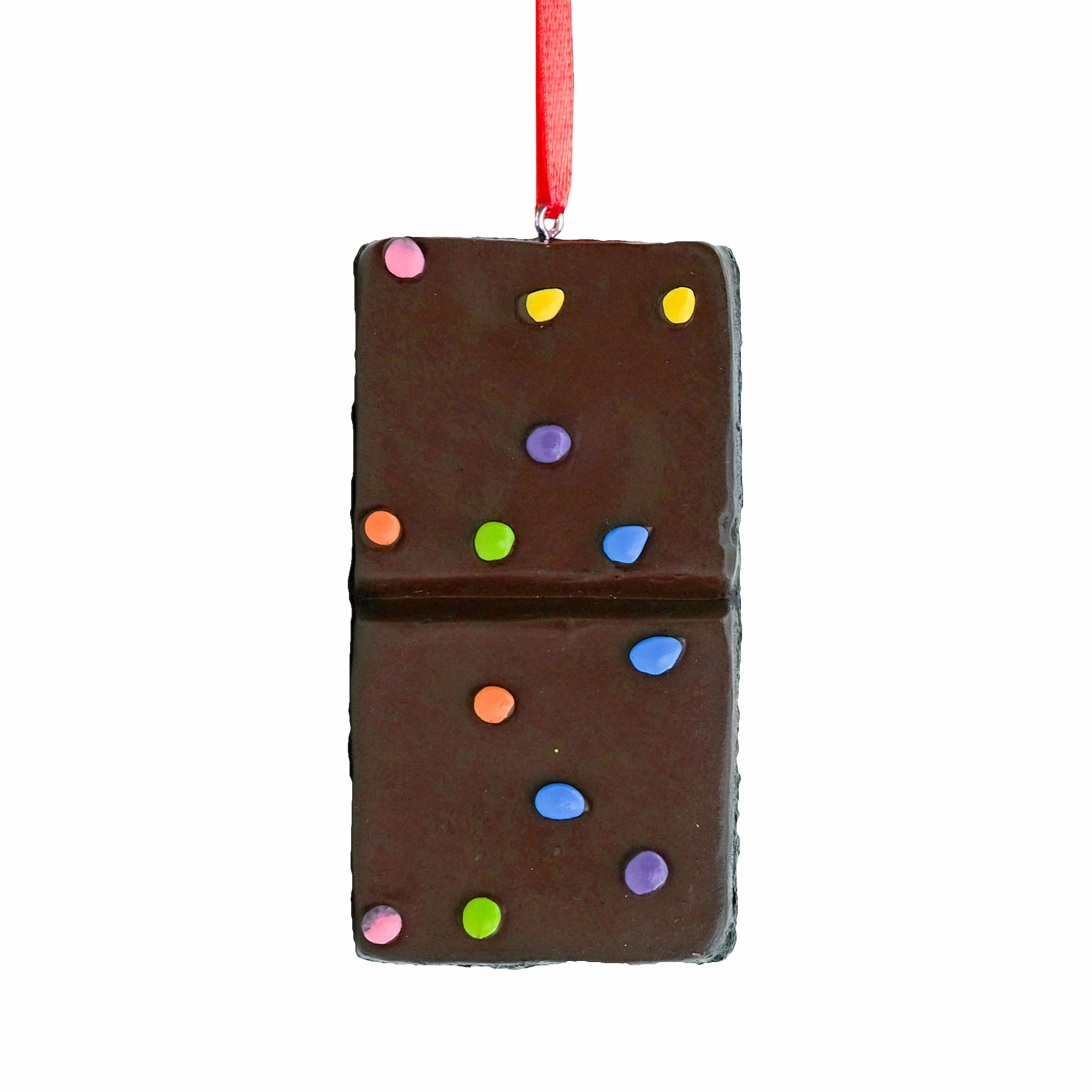 A Little Debbie Cosmic® Brownie Ornament hanging from a red ribbon, designed to look like the brownie topped with colorful candy pieces, displayed against a white background.
