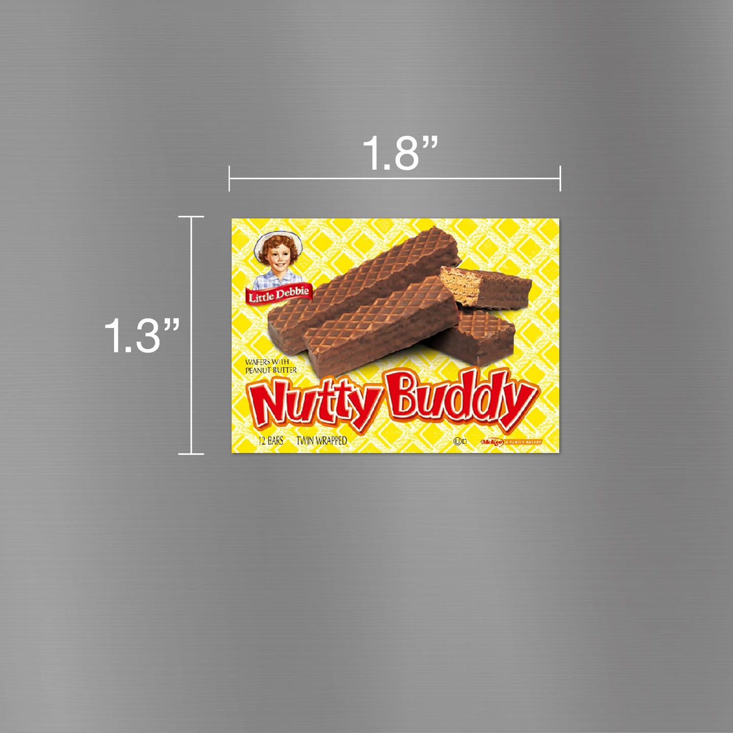 Image of a Little Debbie Nutty Buddy carton magnet, measuring 1.8 inches wide and 1.3 inches tall. The magnet displays the iconic yellow and red packaging with images of the Nutty Buddy wafer bars and the Little Debbie logo. The background features a pattern of yellow diagonal lines, enhancing the visual appeal of the snack's packaging.