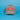 A gray baseball cap featuring a red and white 'Little Debbie' logo patch on the front, set against a solid blue background.