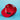 A red snapback cap shown from an angled top-down view, featuring 'Unwrap a smile!' branding printed repeatedly on the underside with Little Debbie tag, set against a solid light blue background.